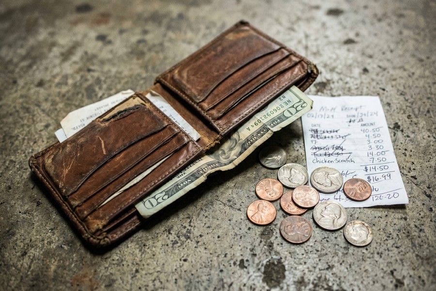 Smartphone showing a cash advance app dashboard with a $500 available balance and no credit check badge